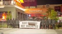 The protesters are pictured outside Northland Shopping Centre