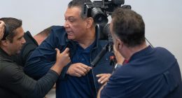 U.S. Sen. Alex Padilla of California is pushed out of the room after he interrupted Homeland Security Secretary Kristi Noem during a news conference in Los Angeles on June 12, 2025.