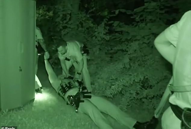 In the distressing footage, two of Swanger's colleagues hold his arms as he is dragged, semi conscious and on his back, out of harms way
