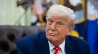 President Donald Trump reacts as Elon Musk speaks at the White House
