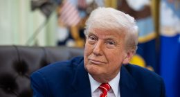 President Donald Trump reacts as Elon Musk speaks at the White House