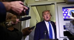 President Donald Trump speaks to reporters aboard Air Force One after departing early from the the G7 summit in Canada to return to Washington