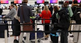 An urgent travel warning has been issued for Australians travelling to or transiting through Qatar (pictured, travellers at Sydney International Airport)
