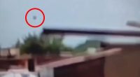 The mysterious piece of debris that flew off the plane into the air is circled here just as the London-bound Boeing 787-8 Dreamliner disappeared from view and crashed