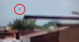 The mysterious piece of debris that flew off the plane into the air is circled here just as the London-bound Boeing 787-8 Dreamliner disappeared from view and crashed