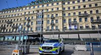 A Swedish police vehicle is parked outside the Grand Hotel during the Bilderberg meeting in Stockholm
