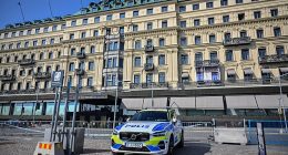 A Swedish police vehicle is parked outside the Grand Hotel during the Bilderberg meeting in Stockholm