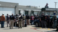Federal immigration agents converge on Glenn Valley Foods in Omaha, Neb., on June 10 for an immigration raid. A new analysis released Thursday estimates mass deportations could cost more than 6 million jobs, a figure that includes both immigrants and U.S.-born workers. (Photo courtesy of U.S. Immigration and Customs Enforcement via Nebraska Examiner)