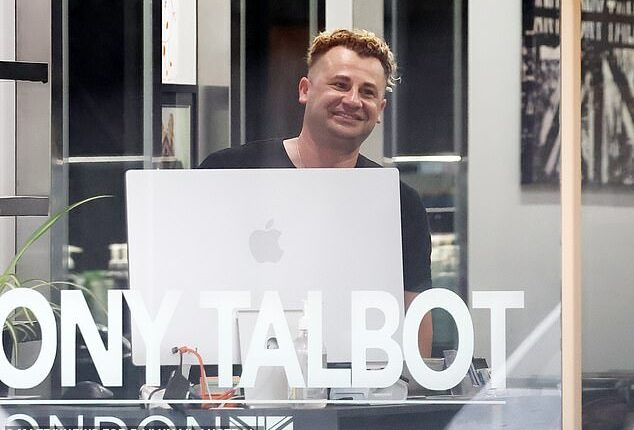 Anthony Koletti appeared to be in good spirits working at his eastern suburbs salon on Wednesday hours before he attended Waverley Police, where he was charged with assault