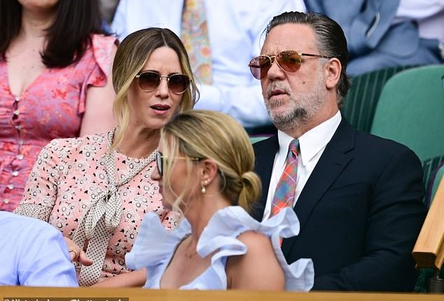 Gladiator star Russell Crowe (right) sat down in the Royal Box alongside his fiancee Britney Theriot (left)