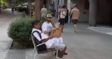 Bizarre moment Oscar-winning Hollywood star shares bread snack with Spanish local who’s no idea who star is – would you?