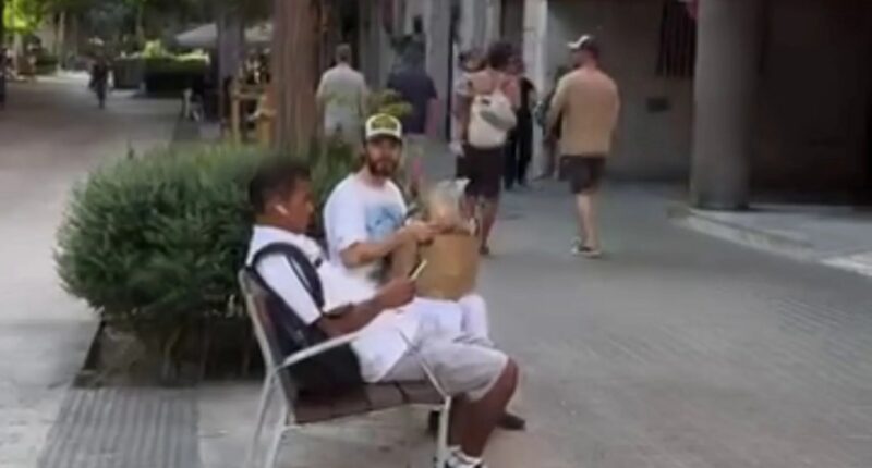 Bizarre moment Oscar-winning Hollywood star shares bread snack with Spanish local who’s no idea who star is – would you?