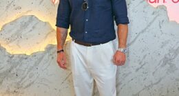 Chris Hemsworth attended Evian's VIP suite on the final day of Wimbledon without his wife Elsa Pataky on Sunday