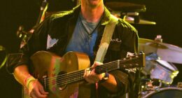 Coldplay's Chris Martin gave fans a warning at his first concert since a kiss cam at the band's previous gig exposed a CEO and his subordinate getting cozy