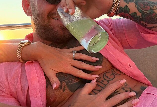 Conor McGregor's fiancee Dee Devlin couldn't keep her hands off him in a new social media snap of the duo on a yacht holiday