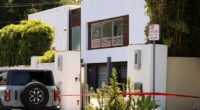 According to neighbors, a person, who may have been armed, was spotted hopping a fence on the tree-lined street in the ritzy California neighborhood