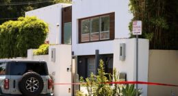 According to neighbors, a person, who may have been armed, was spotted hopping a fence on the tree-lined street in the ritzy California neighborhood