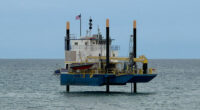 An exploratory rig offshore of South 6th Street in Flagler Beach on May 22, the landing location of planned undersea cables that will connect to a Cable Landing Station in Flagler Beach before snaking to a data center in Palm Coast. (© FlaglerLive)