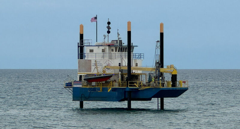 An exploratory rig offshore of South 6th Street in Flagler Beach on May 22, the landing location of planned undersea cables that will connect to a Cable Landing Station in Flagler Beach before snaking to a data center in Palm Coast. (© FlaglerLive)