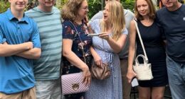 A woman whose mom was fiercely slammed over her 'rude' reaction to her pregnancy reveal has explained what really happened