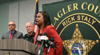 Superintendent LaShakia Moore with Sheriff Rick Staly and School Board Chair Will Furry during a press conference last May. (© FlaglerLive)