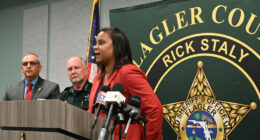 Superintendent LaShakia Moore with Sheriff Rick Staly and School Board Chair Will Furry during a press conference last May. (© FlaglerLive)