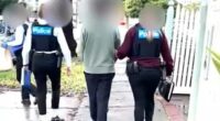 Doctor Ryan Yi Cho, 28, (centre) was arrested on Friday and charged with three counts of producing an intimate image after allegedly secretly recording videos of his hospital co-workers