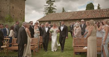 Heart-warming footage captures the moment a bride's father invites her stepfather to walk down the aisle with them