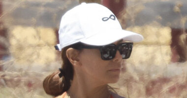 Eva Longoria, 50, puts her fit figure on display in a cheeky orange bikini on beach in Spain
