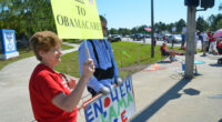 They almost get their wish, 13 years later: a tea party demonstration on Palm Coast Parkway on March 26, 2012. (© FlaglerLive)