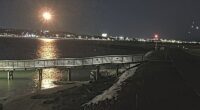 The footage shows a bright flash lighting up the night sky above the Potomac River