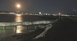 The footage shows a bright flash lighting up the night sky above the Potomac River