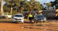 Police are pictured at the scene of the crash in Albany, WA on Wednesday afternoon