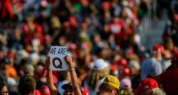 QAnon supporters wait for Donald Trump to speak at a campaign rally at Atlantic Aviation on September 22, 2020, in Moon Township, Pennsylvania.