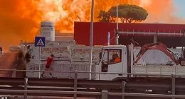 A civilian sprints away from a huge explosion at the petrol station