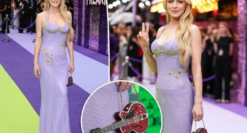 Lindsay Lohan rocks mini bedazzled guitar purse on ‘Freakier Friday’ UK premiere red carpet