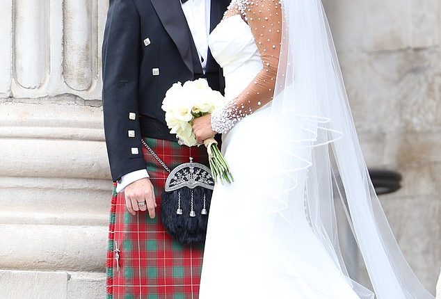 Mel B was every inch the blushing bride as she shared a kiss with new husband Rory McPhee after they married at St Paul's Cathedral in London on Saturday