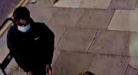 Dramatic CCTV footage shows Emma Van Der Hoek looking down at her phone along a straight path, when a man comes up behind her