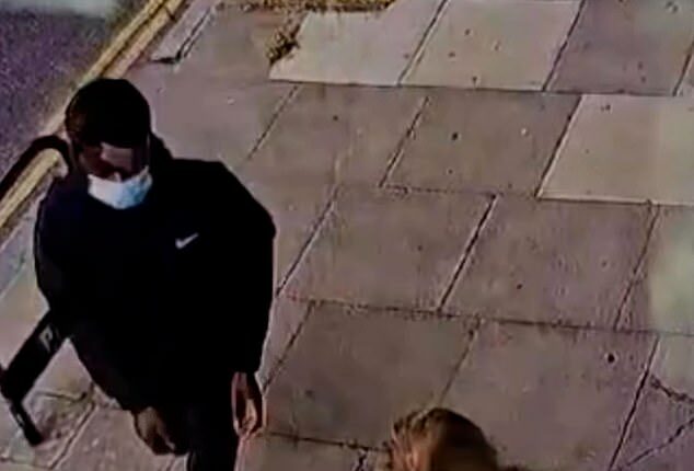 Dramatic CCTV footage shows Emma Van Der Hoek looking down at her phone along a straight path, when a man comes up behind her