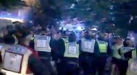 In shocking footage posted online, crowds clashed with officers last night in Havant, Hampshire, as armed police with riot shields took the 38-year-old into custody