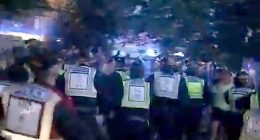 In shocking footage posted online, crowds clashed with officers last night in Havant, Hampshire, as armed police with riot shields took the 38-year-old into custody