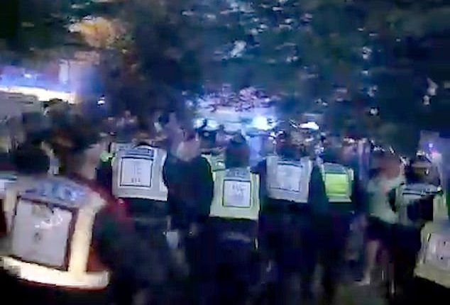In shocking footage posted online, crowds clashed with officers last night in Havant, Hampshire, as armed police with riot shields took the 38-year-old into custody