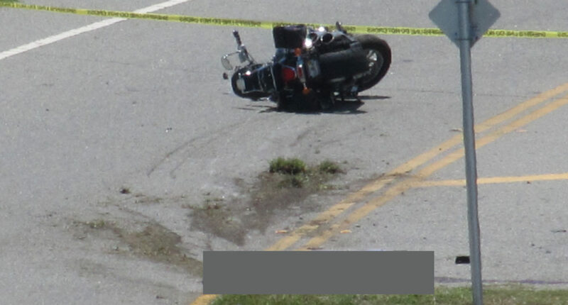 The crash scene on State Road A1A on Thursday afternoon. The victim--blocked out--remained at the scene until the medical examiner claimed the body in mid-afternoon. (© Bob Ziolkowski for FlaglerLive)