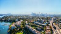 Real estate agents are charging more for the same amount of work, experts say (an aerial shot of Rozelle, in Sydney's inner west is pictured)