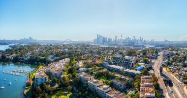 Real estate agents are charging more for the same amount of work, experts say (an aerial shot of Rozelle, in Sydney's inner west is pictured)