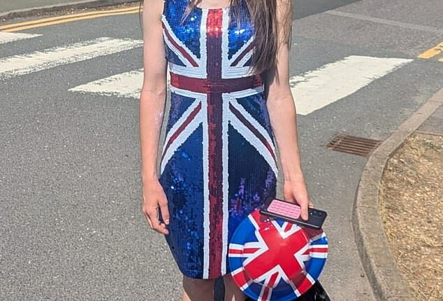 Courtney Wright poses for a photo showing her costume after being made to leave school on culture day