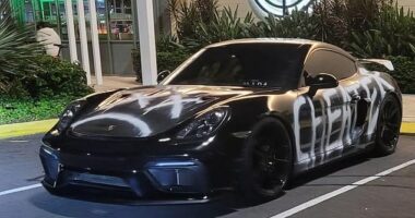 A Porsche graffitied with the word 'cheater' has been see parked in busy public places around the Gold Coast - with Aussies quick to crack jokes at its owner's expense
