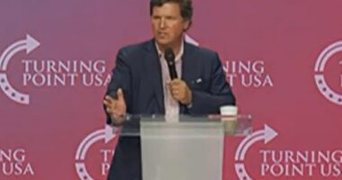 Tucker Carlson (pictured) addressed the Turning Point USA Student Action Summit audience on Friday night