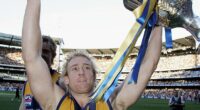 Michael Braun of the Eagles celebrates with the trophy after the AFL Grand Final in 2006