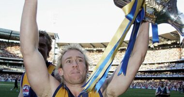 Michael Braun of the Eagles celebrates with the trophy after the AFL Grand Final in 2006